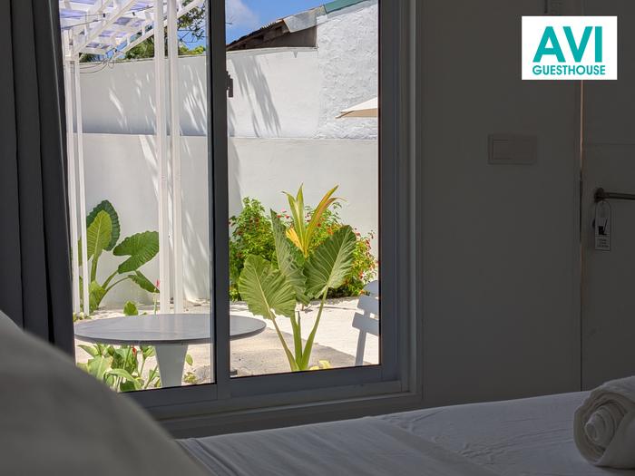 View from the bed to the private garden terrace